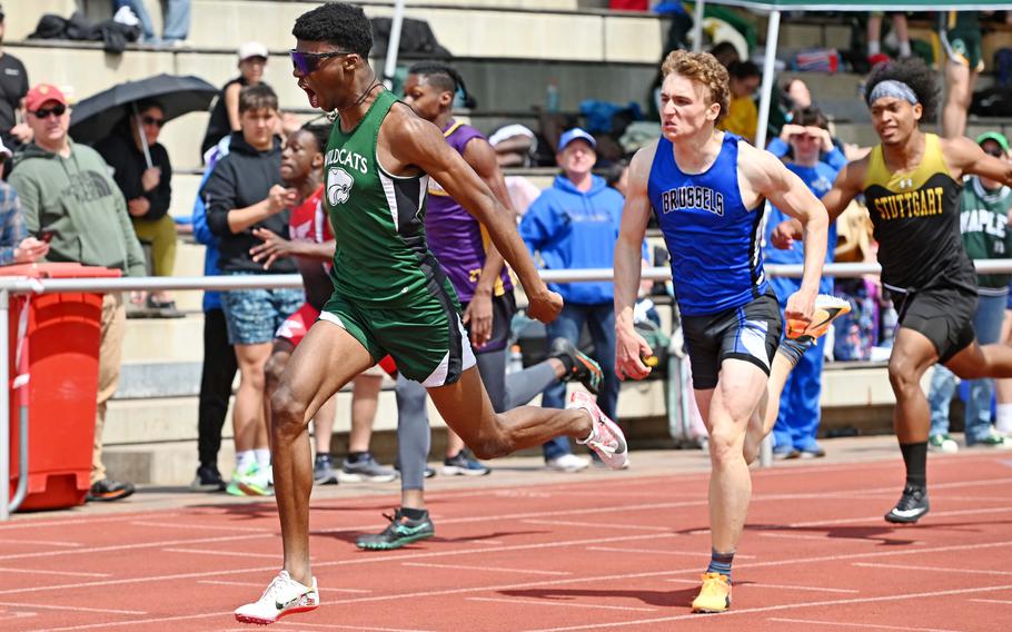 Naples’ Christopher White reacts as he crosses the finish line in the boys 200-meter race at the DODEA-Europe track and field championships in Kaiserslautern, Germany,, May 20, 2023, in 22.31 seconds, ahead of Brussels’ William Pierce, center.