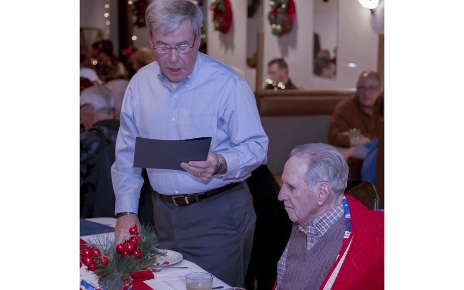 Retired Massillon Judge Richard Kettler reads a proclamation proclaiming Friday, Dec. 10, 2021 as Guy Atkinson Day.