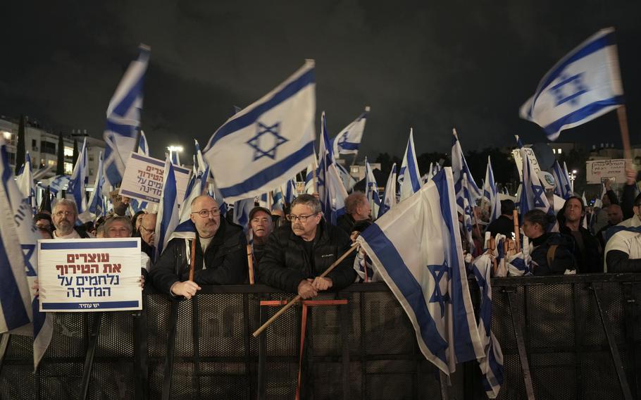 Israelis protest against the government’s plans to overhaul the country’s legal system, in Tel Aviv, Israel, Saturday, Jan. 14, 2023. The new government unveiled its plan this month proposing changes that critics say will weaken the country’s judiciary and imperil its democratic system of checks and balances. 