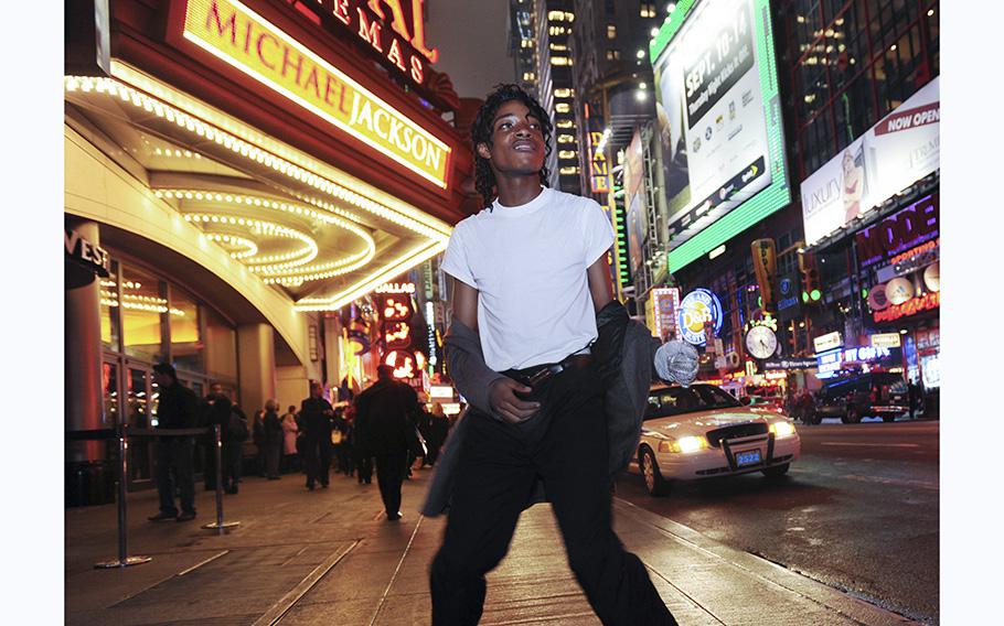Jordan Neely is pictured before going to see the Michael Jackson movie, “This is It,” outside the Regal Cinemas in Times Square in 2009. Neely, on Monday, May 1, 2023, began acting erratically passengers on a train told police. He yelled and threw garbage at commuters, prompting an argument with a 24-year-old Marine, police said.