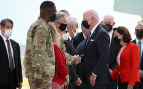 The commander of U.S. Forces Japan, Lt. Gen. Ricky Rupp, welcomes President Joe Biden at Yokota Air Base in western Tokyo, Sunday, May 22, 2022. 