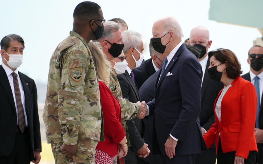 The commander of U.S. Forces Japan, Lt. Gen. Ricky Rupp, welcomes President Joe Biden to Yokota Air Base in western Tokyo, Sunday, May 22, 2022. 