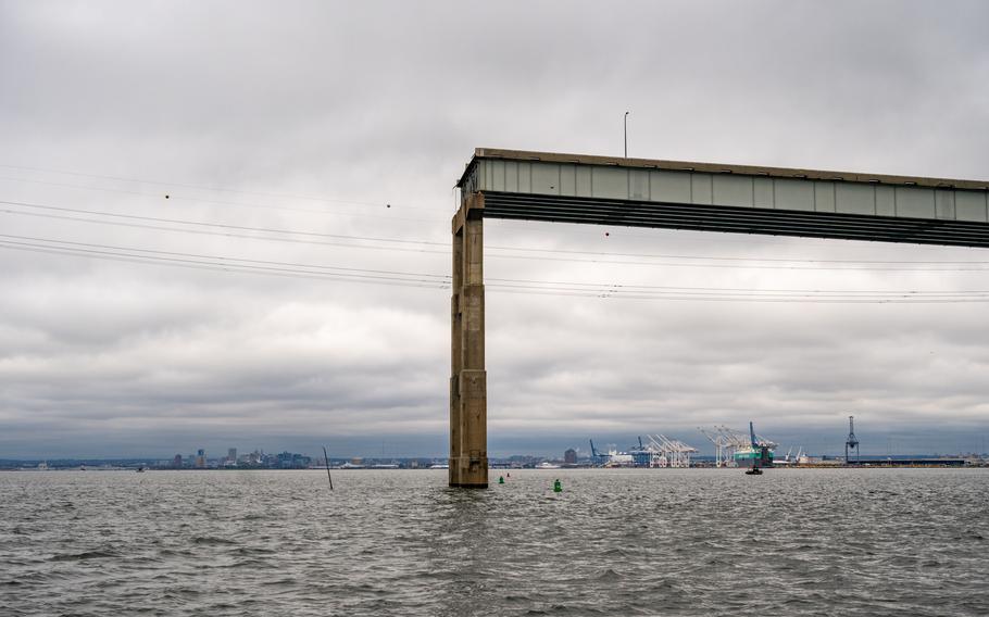 A temporary channel for smaller vessels opens below a remaining piece of the Francis Scott Key Bridge. 