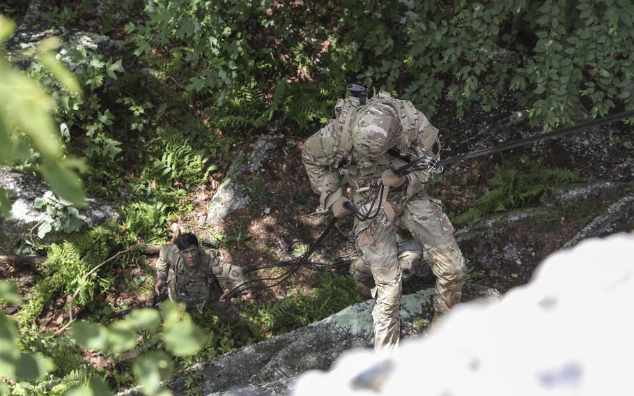 A Pennsylvania Army National Guard soldier rappels down the south face of the Boxcar Rocks formation during training, June 13, 2023.