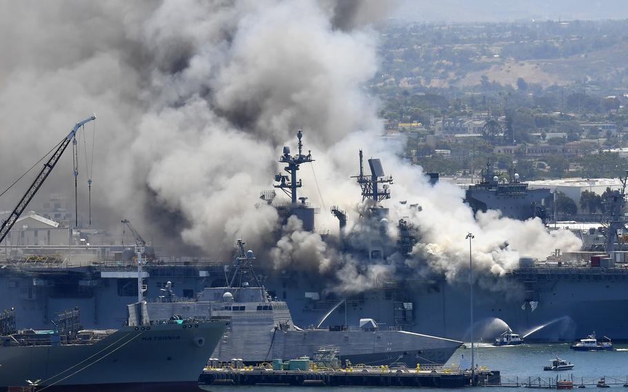 In this July 12, 2020, file photo, smoke rises from the USS Bonhomme Richard at Naval Base San Diego after an explosion and fire on board the ship at the base. 