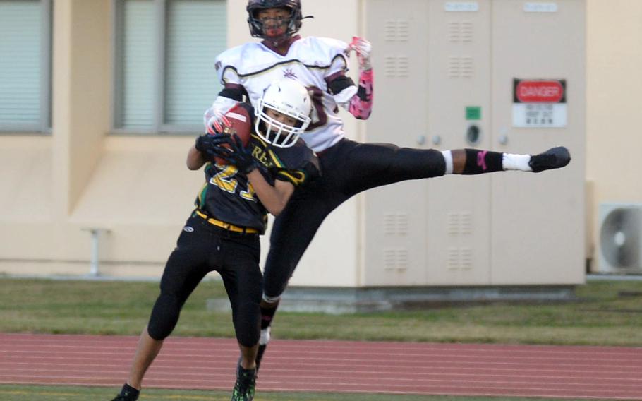 Edgren's Hajime Reed intercepts a pass intended for Perry receiver Shion Fleming.