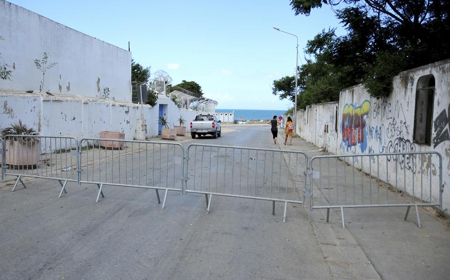 The access road to the beach is closed due to reinstated COVID-19 restrictions in La Marsa, Tunisia, Saturday.