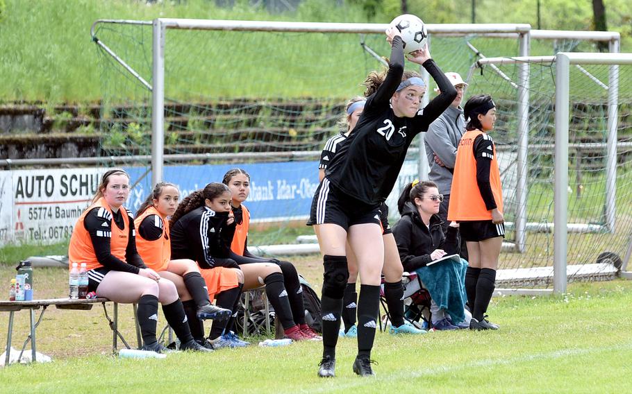 Vicenza junior Laurel Gill throws in the ball in front of the Cougar bench during a Division II semifinal against Black Forest Academy at the DODEA European soccer championships on May 17, 2023, at VfR Baumholder’s stadium in Baumholder, Germany.