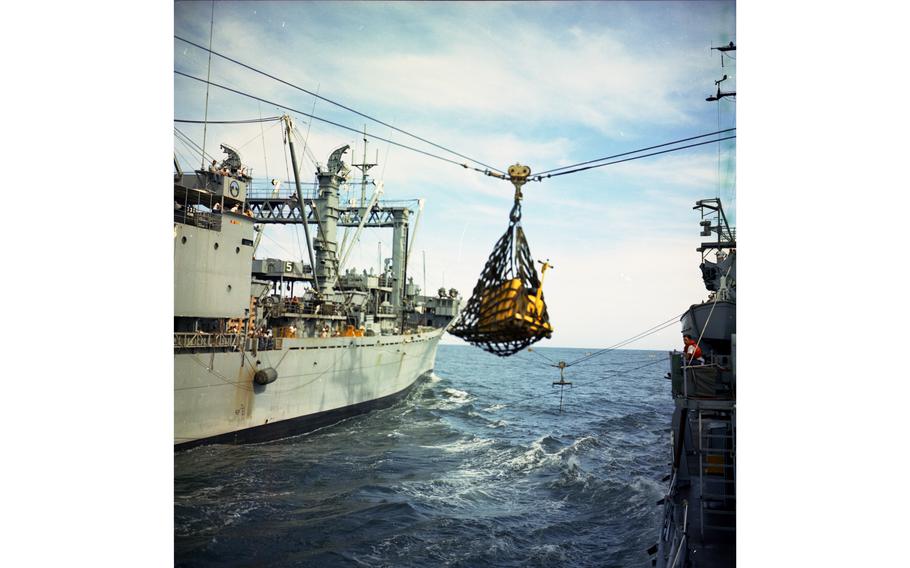 Equipment is hoisted aboard the USS Buchanan destroyer from the USS Haleakala (AE-25) during resupply operations, July 15, 1968.