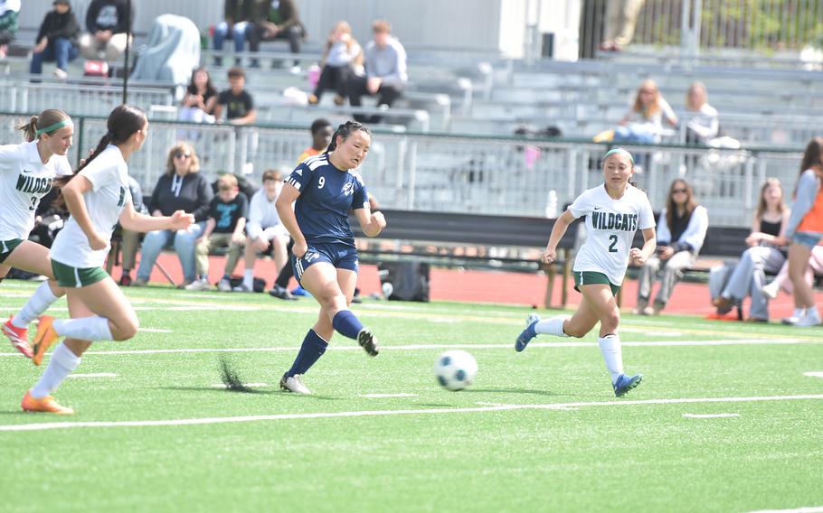 Esther Lee takes a shot at a goal.
