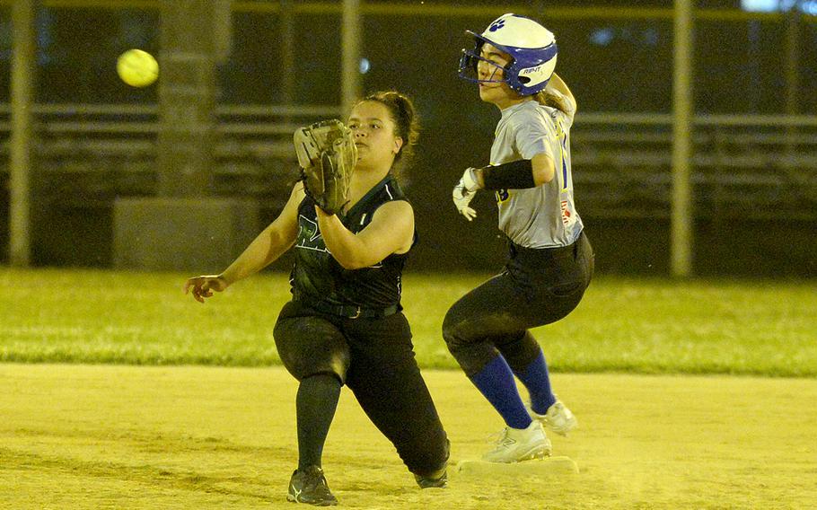 Yokota's Alicia Tanoue slides safely into second base ahead of the throw to Kubasaki shortstop Mia Vedsted during Friday's softball doubleheader. The Dragons won the opener 19-18 and the nightcap 14-7.