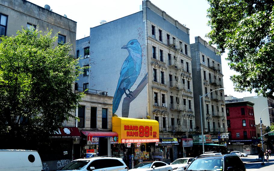 A blue pinyon jay painted by Vermont artist Mary Lacy perches at 3668 Broadway in Manhattan, seen on June 26, 2022. 