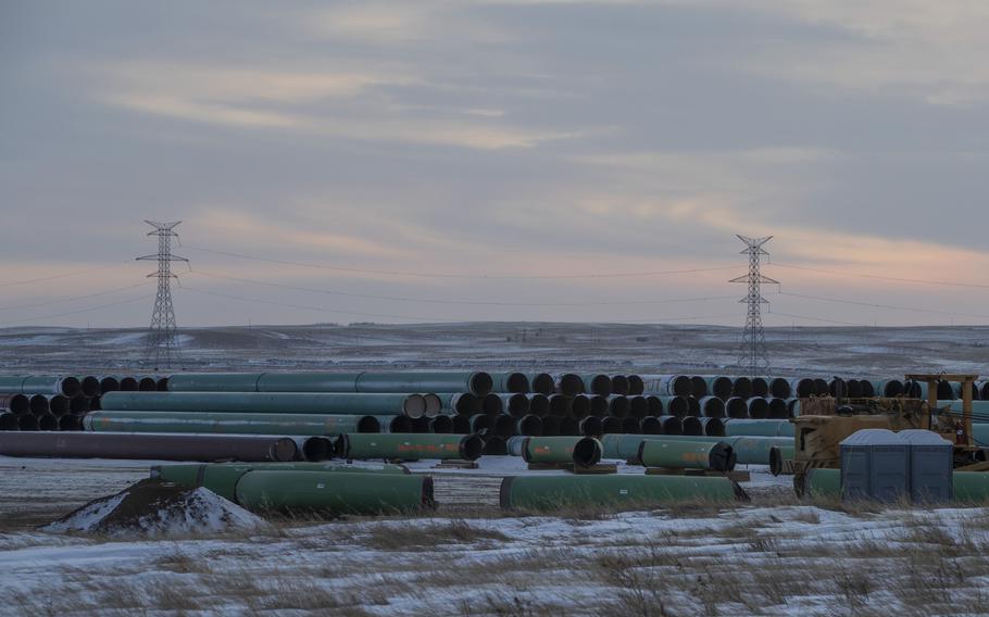 Pipes for the Keystone XL pipeline stacked in a yard near Oyen, Alberta, on Jan. 26, 2021. 