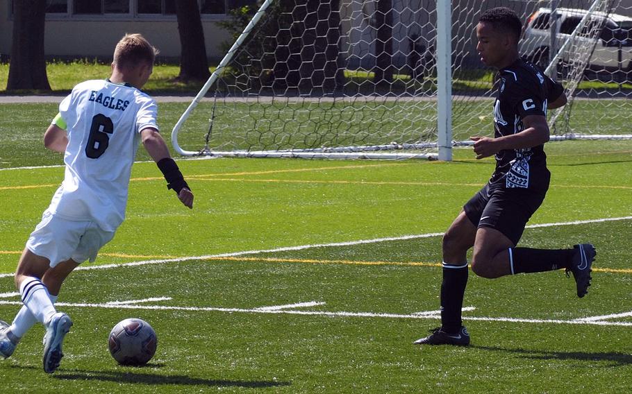 Edgren's Cayne Redmond sets up to cross the ball against Zama's Chris Jones.