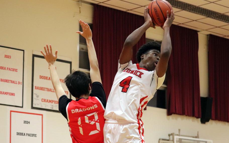 Elijah Mosley grabs a rebound.