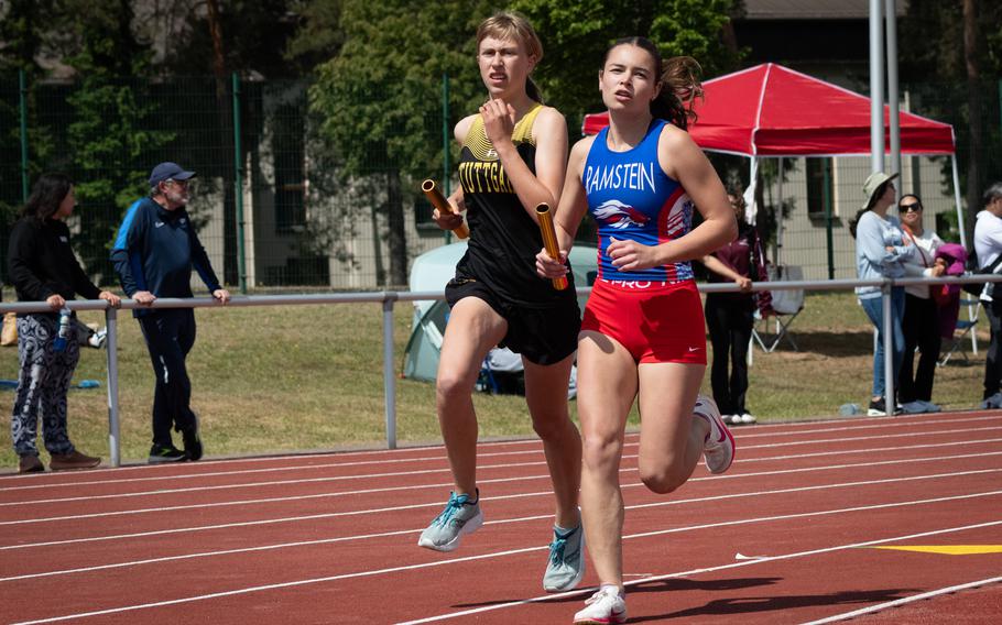 Stuttgart’s Anna Konon and Ramstein’s Iliana Echard battle for the lead during the second leg of the girls’ 3,200-meter relay at the DODEA Europe track and field championships on Thursday, May 22, 2025, in Kaiserslautern, Germany. Stuttgart went on to the win the event in 9:57.91, about three seconds faster than Ramstein. Kendall Cancel, Pasha Miletich and Lydia Pound were the other runners for Stuttgart.
 