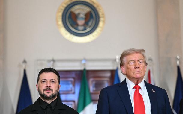 President Donald Trump and Ukrainian President Volodymyr Zelenskyy stand for a family photo with European leaders in the Cross Hall of the White House in Washington, D.C., on Aug. 18, 2025. (Andrew Caballero-Reynolds/AFP/Getty Images/TNS)
