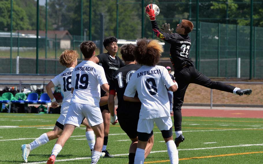 Ansbach keeper Jack Lovello goes high to pull in a ball against Alconbury in the Division III boys final at the DODEA-Europe soccer championships in Ramstein, Germany, May 22, 2025. The Cougars beat the Dragons 1-0 to capture the D-III crown.