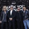 From left, David Bryan, Jon Bon Jovi, Tico Torres and Gotham Chopra pose for photographers upon arrival at the premiere of the film “Thank You, Good Night: The Bon Jovi Story,” in London on April 17. The docuseries debuts on Hulu Friday.