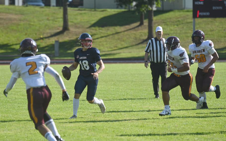 Lakenheath’s Senior QB Nico Marchini scrabbles out of the pocket before throwing downfield during Lakenheath’s football game against Vilseck on Friday, Sept. 15 in Vilseck, Germany.