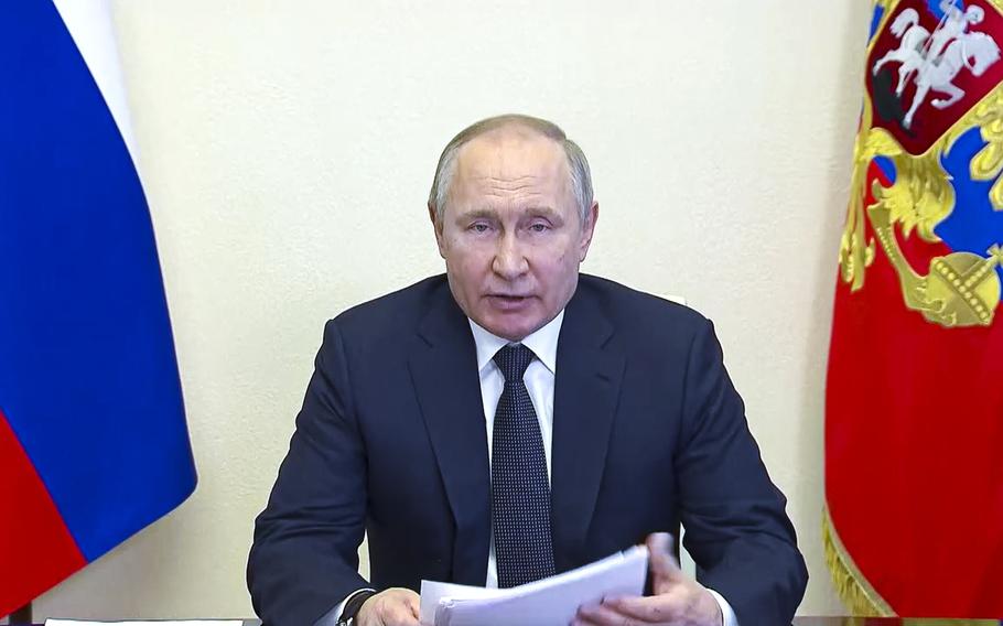 In this photo taken from video released by the Russian Presidential Press Service, Russian President Vladimir Putin speaks via videoconference at the Novo-Ogaryovo residence outside Moscow, Russia, Wednesday, March 16, 2022. 