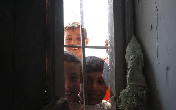 Hed: Peeking in, 2003

Shanafiya, Iraq, August 2003: Boys stare through the broken windows of a local school in the village of Shanafiya in southern Iraq. Civil affairs personnel are improving and resupplying schools across Iraq that have been devastated by war and neglect prior to the war.

Read the article on the work the 432nd Civil Affairs Battalion was doing in Shanafiya here. 
https://www.stripes.com/living/civil-affairs-helps-local-iraqis-recover-from-war-looting-1.31638

META TAGS: Operation Iraqi Freedom; Government Support Teams; 432nd Civil Affairs Battallion; education; Company L, 3rd Battalion, 5th Marine Regiment; 
