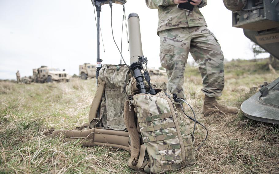 A book bag in front of a device used in electronic warfare.