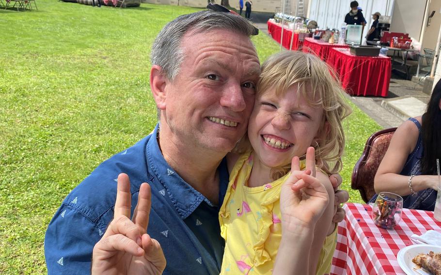 The late Charles Mecke, food and beverage flight chief for the 374th Force Support Squadron at Yokota Air Base, Japan, poses with daughter Annabelle in this undated photo.