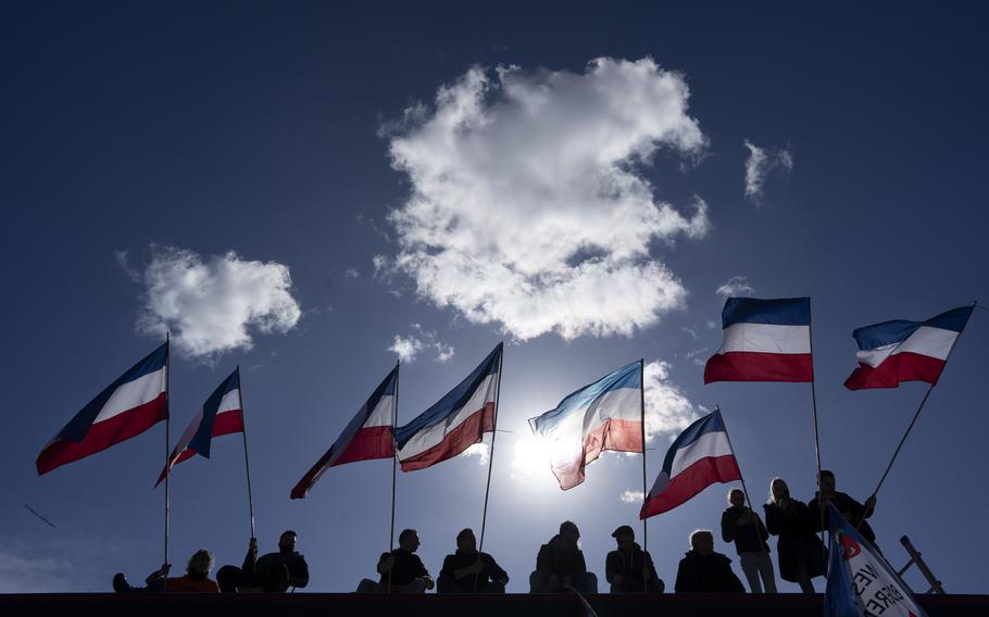 Netherlands flags fly upside-down in protest as thousands of demonstrators joined an anti-government protest by farmers’ organizations in The Hague, Netherlands, Saturday, March 11, 2023. The protest comes days before Dutch provincial elections on March 15, in which a party representing farmers’ interests is expected to perform well. 