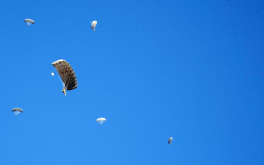 Paratroopers from the U.S. Army’s 11th and 82nd Airborne Divisions prepare to land at Camp Narashino in Chiba prefecture, Japan, Sunday, Jan. 8, 2023. 