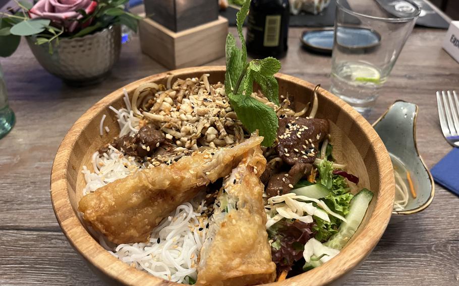 The bun nam bo with beef and a spring roll at Kiko in Kaiserslautern, Germany. While sushi is featured prominently, the restaurant has Vietnamese roots.