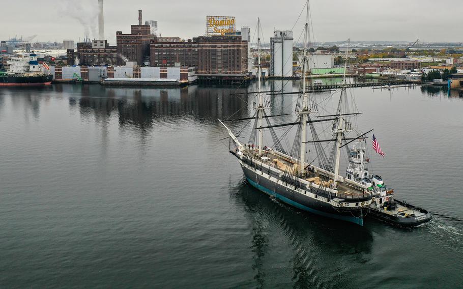The historic USS Constellation is pushed out of the Inner Harbor en route to dry dock at Tradepoint Atlantic for hull repairs.
