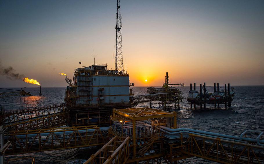 Gas flares burn from pipes aboard an offshore oil platform in the Persian Gulf’s Salman Oil Field, operated by the National Iranian Offshore Oil Co., near Lavan island, Iran, on Jan. 5. 2017. 