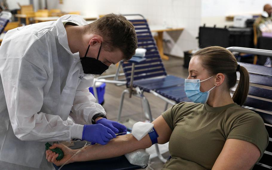 Capt. Shelby Aleksick, a nurse with the 30th Medical Brigade, donates blood in January 2022 at Rhine Ordnance Barracks in Kaiserslautern, Germany. Service members, veterans and civilians once barred from donating blood because they lived in Europe decades ago during transmission of mad cow disease may now again give blood. 