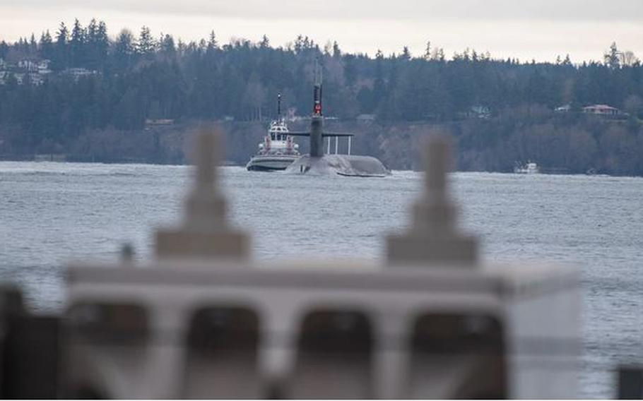 The Ohio-class ballistic missile submarine USS Kentucky returns to its homeport of Naval Base Kitsap-Bangor, Washington, Dec. 21, 2021. A small Navy vessel sank at the base on Thursday, Jan. 19, 2023, injuring three sailors, the Navy said.