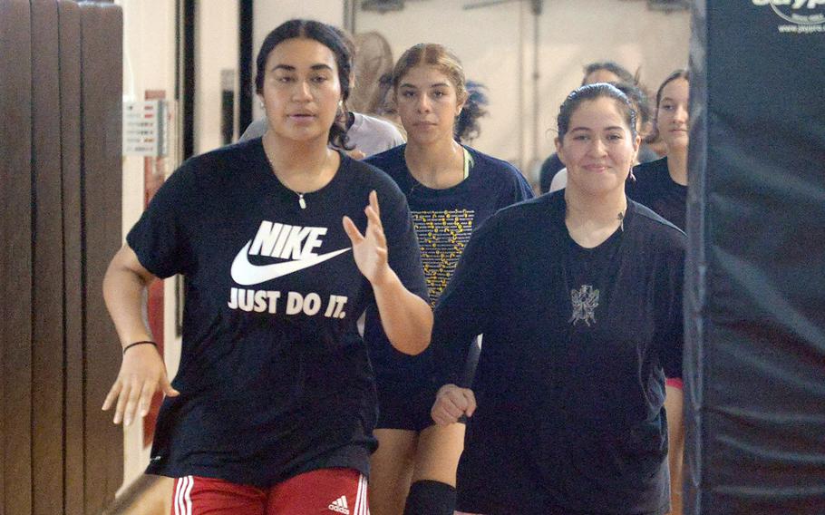 Senior Kierstyn Aumua, left, is a returning starting middle blocker for Zama's volleyball team.