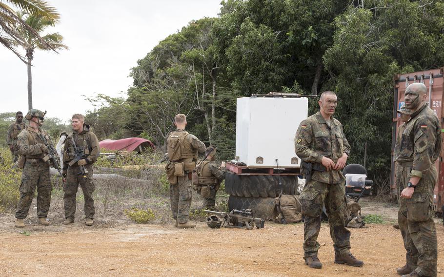 U.S. and German troops chat during Talisman Sabre training near Stanage Bay, Australia, Wednesday, Aug. 2, 2023. 