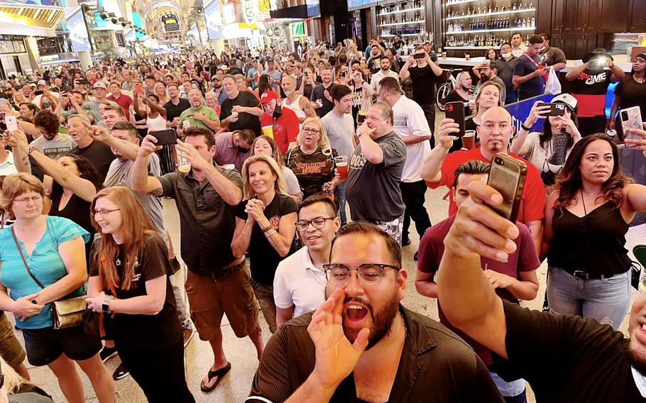 A crowd gathers at Las Vegas's Fremont Street area to watch a midnight concert celebrating the lifting of pandemic restrictions June 1. 