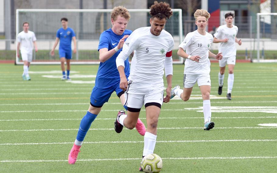 SHAPE center back Tycho Kluivert beats Ramstein's Joseph Yost to a ball during a match on April 5, 2024, at Ramstein High School on Ramstein Air Base, Germany.