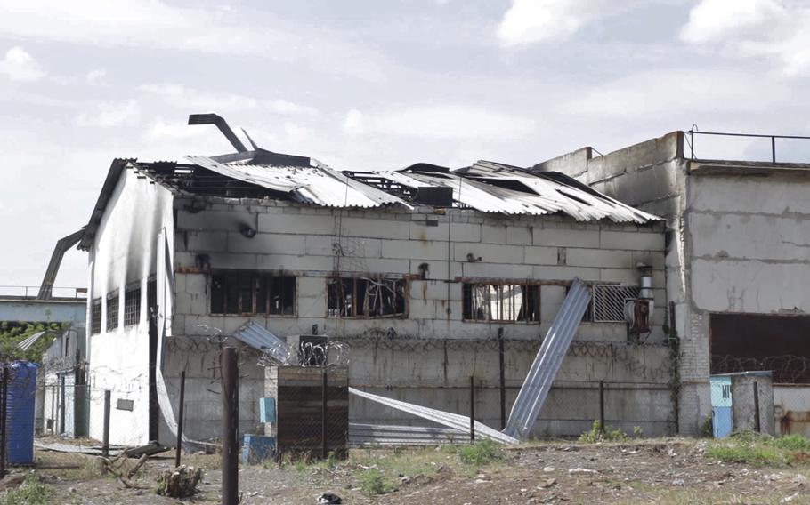 In this photo taken from video a view of a destroyed barrack at a prison in Olenivka, in an area controlled by Russian-backed separatist forces, eastern Ukraine, on July 29, 2022. Russia and Ukraine accused each other Friday of shelling a prison in a separatist region of eastern Ukraine, an attack that reportedly killed dozens of Ukrainian military prisoners who were captured after the fall of a southern port city of Mariupol in May.