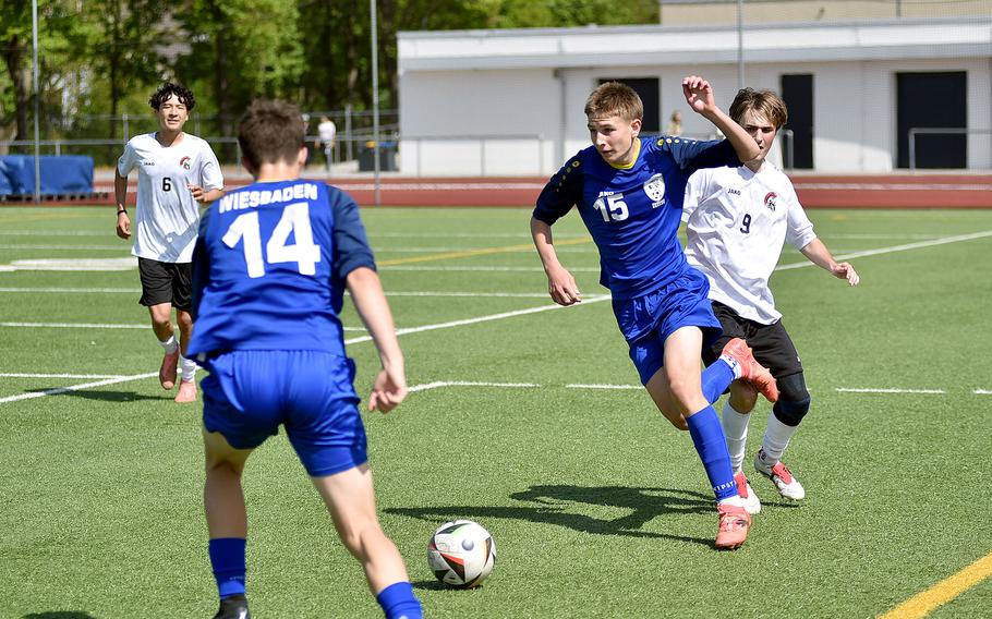 Robert Milan tries to get past Max Worley.