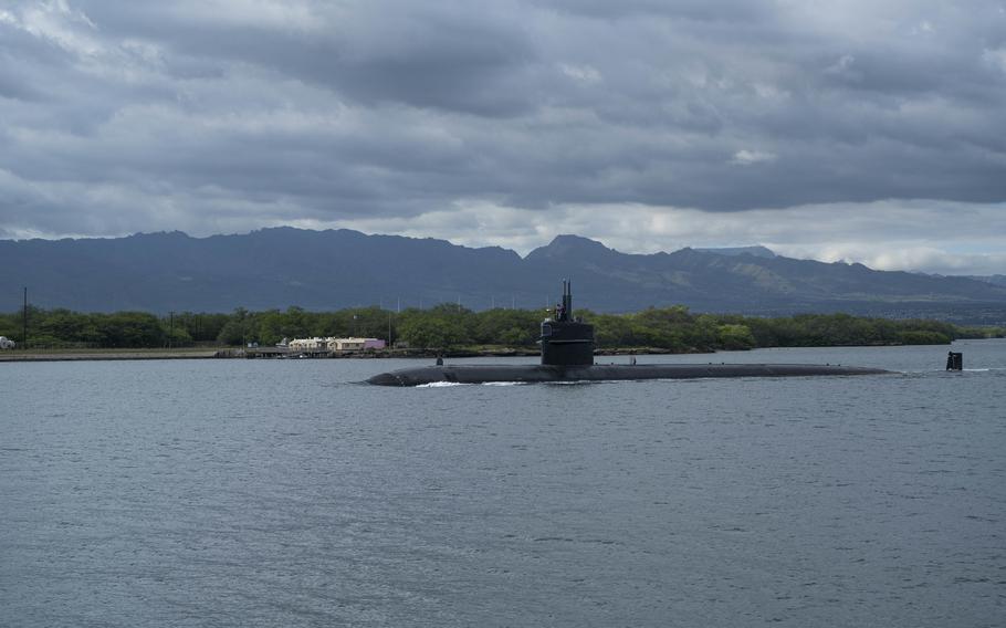 The Los Angeles-class fast-attack submarine USS Chicago (SSN 721) gets under way from Joint Base Pearl Harbor-Hickam, Jan. 8, 2023. Chicago, the fourth U.S. Navy ship to be named for the Illinois city, began the inactivation and decommissioning process at Puget Sound Naval Shipyard after 36 years of service.