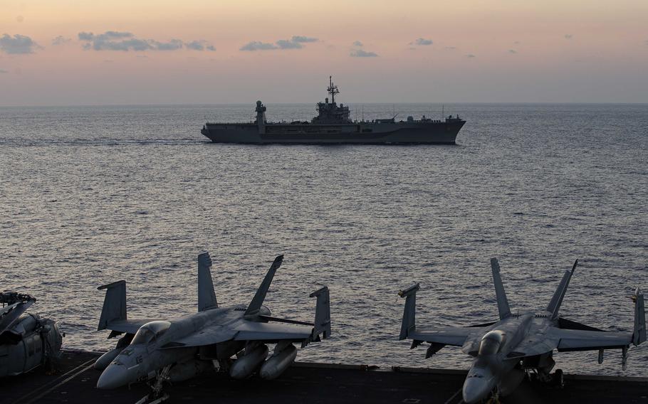 The USS Mount Whitney steams alongside the aircraft carrier USS Gerald R. Ford in the Mediterranean Sea, Oct. 3, 2023. Mount Whitney departed its port in Gaeta, Italy, Oct. 18, to join other U.S. ships, including the Ford, in the eastern Mediterranean, the Navy said in a statement. 