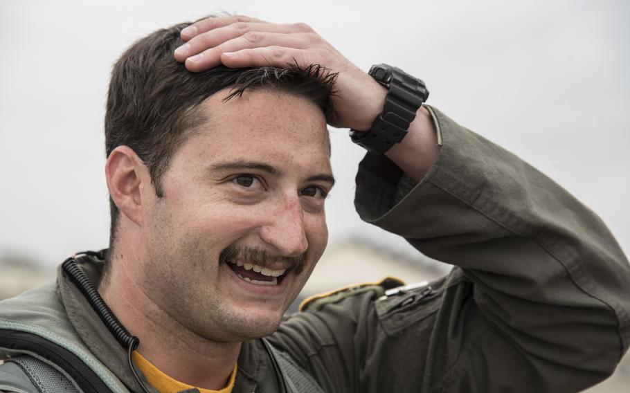 An F-16 demonstration team pilot wipes sweat from his head at Misawa Air Base, Japan, April 18, 2018. A draft memo shared on social media indicates that airmen may soon be allowed to wear wider mustaches.
