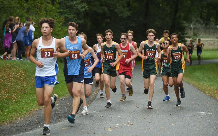 A pack of runners starts to separate during the first lap of the boys 3.1-mile cross country race at Vilseck, Germany, Saturday, Sept. 10, 2022.