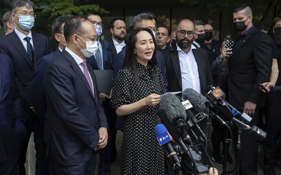 Meng Wanzhou, chief financial officer of Huawei, reads a statement outside B.C. Supreme Court in Vancouver, British Columbia, Friday, Sept. 24, 2021. 