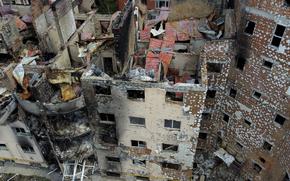 Damaged buildings ruined by attacks are seen in Irpin, on the outskirts Kyiv, Ukraine, Thursday, May 26, 2022. (AP Photo/Natacha Pisarenko)