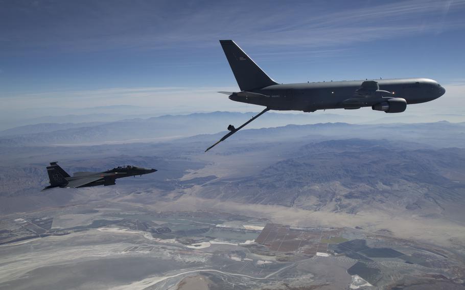 A KC-46A Pegasus aerial refueling aircraft connects with an F-15 Strike Eagle test aircraft from Eglin Air Force Base, Fla., in 2018.  