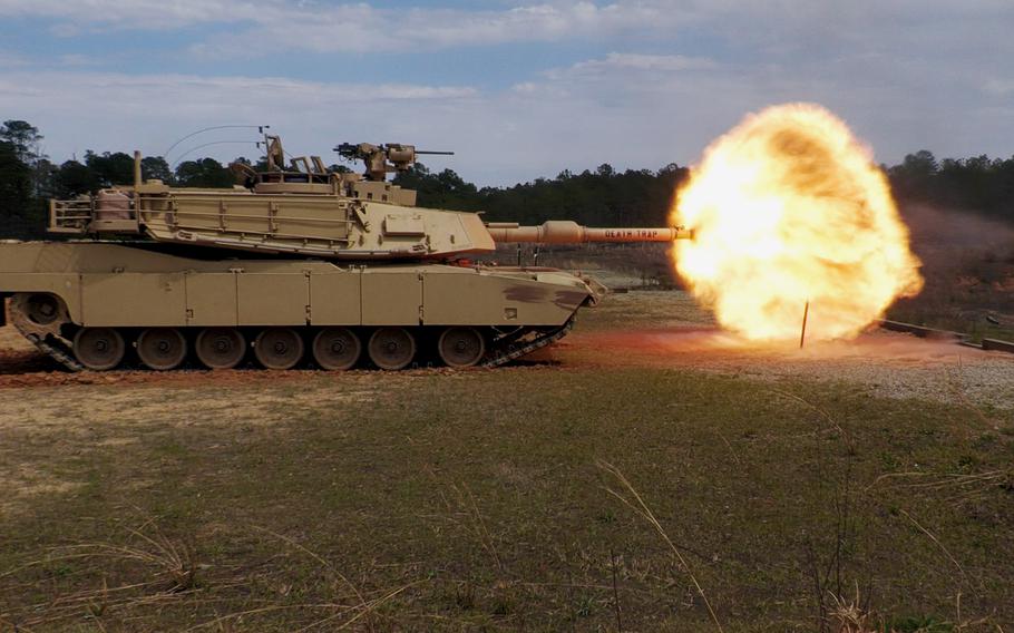 An Abrams battle tank fires downrange during a demonstration at Fort Benning, Ga. The work environment for military personnel abounds in loud noises, putting troops at risk of developing tinnitus.