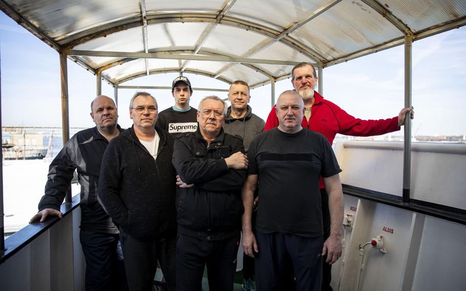 The crew of the Ocean Force has been on the ship since July, following along as their country Ukraine, has been invaded by Russia. From the left, Koval Vadym, 56, second engineer; Vitaliy Boyko, 53, third officer; Taupe Andrii, 19, steward; Gennadiy Shevchenko, 60, captain; Viktor Kushmila, 56, chief officer; Volodymyr Shykhov, 60, chief engineer; and Kuzhbarenko Sergiy, 56, bosun.